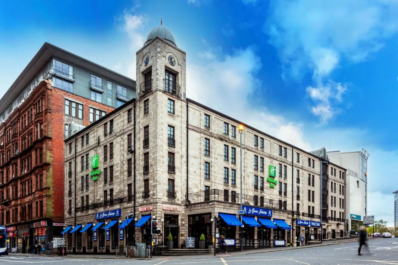 a building with a clock tower on top of it at Holiday Inn Glasgow City Theatreland by IHG in Glasgow